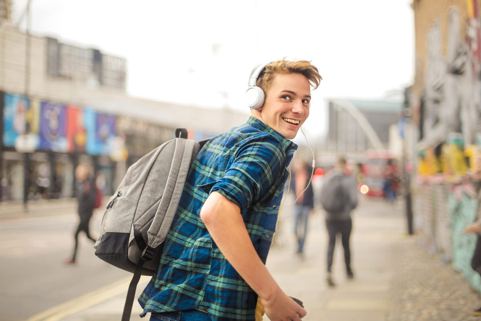 young student smiling outside school