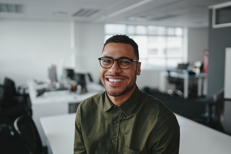 man smiling in office