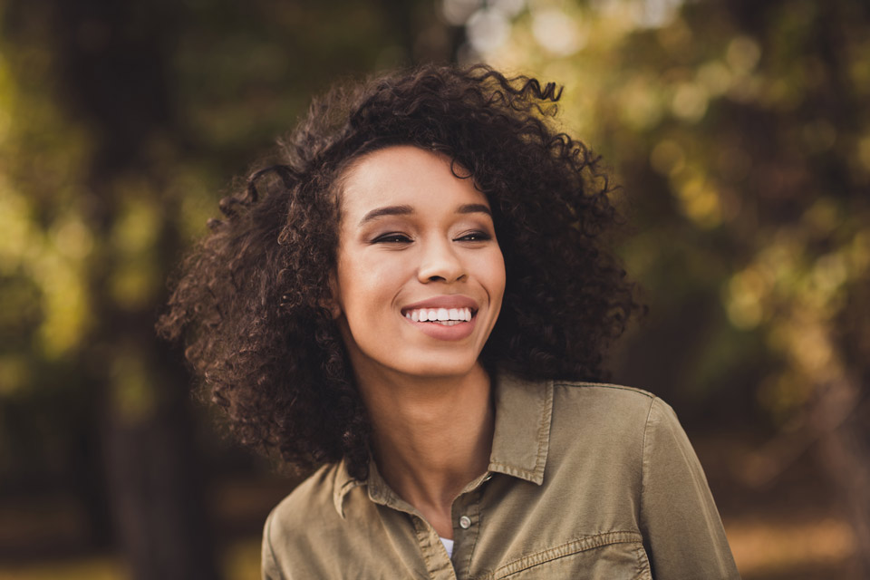 woman smiling outside